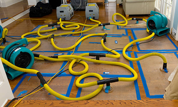 Professional Flood Damage Restoration technician working in Clear Lake, WI